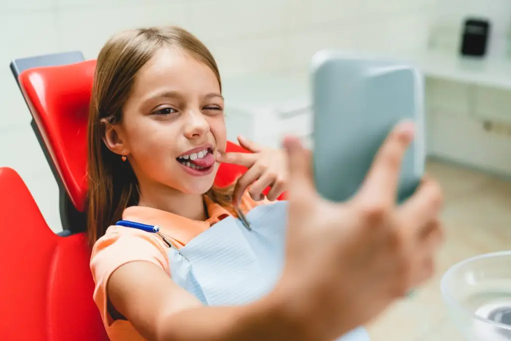 girl taking selfie sitting on dentistry chair vis 2021 12 09 04 23 38 utc 1 1