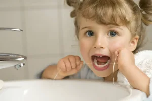 Diversión con el hilo dental: descubriendo el significado del uso del hilo dental en los niños' Odontología