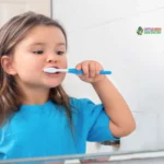 Child brushing teeth in bathroom